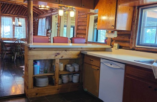 Gaylord Cabin | Cozy log cabin on quiet lake. Games, kayaks, and more for all-season fun.