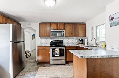 Grand Haven House | Cozy lower level duplex. Pet friendly with a large backyard!