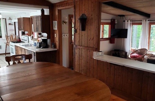 Lake Ann House | Cozy waterfront sunset cottage on Herendeene Lake in Lake Ann, Dock, Dog ok