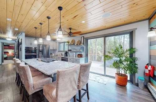 Eagle River House | Cozy Wooded home with WIFI, Gas Grill, Two Kitchens, Near Lakes & Trails