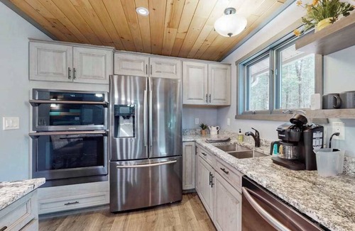 Eagle River House | Cozy Wooded home with WIFI, Gas Grill, Two Kitchens, Near Lakes & Trails
