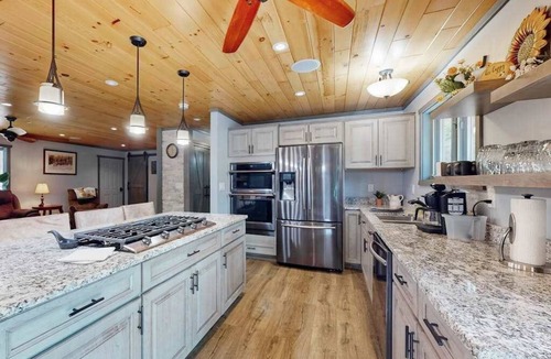 Eagle River House | Cozy Wooded home with WIFI, Gas Grill, Two Kitchens, Near Lakes & Trails