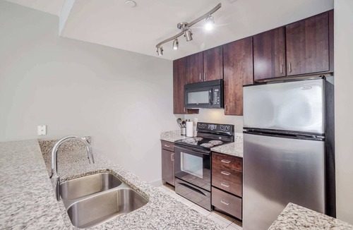 Central Business District Apartment | CozySuites at the Banks gym, pool 13