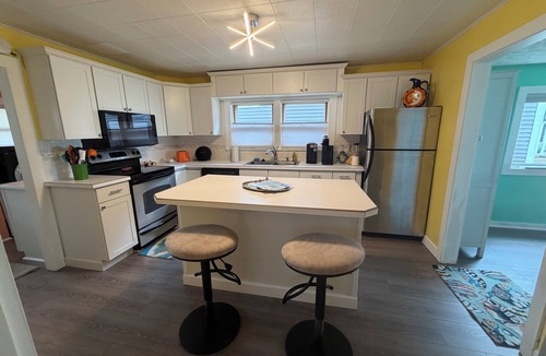 Bay City House | Cute house on Saginaw Bay with hot tub on private beach.