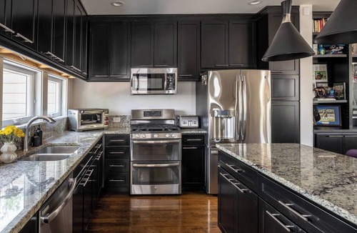 West Suburb House | Designer home is short walk to Rupp & Manchester