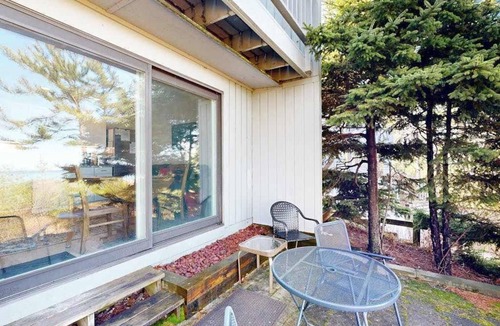 Glen Arbor Condo | Desirable beachfront condo in Glen Arbor with patio, fireplace, kitchenette & AC