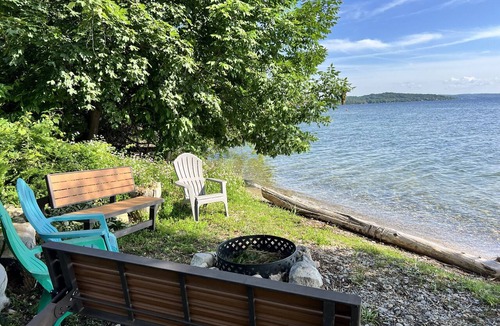 Traverse City House | Direct Lake Leelanau sunset view, fire pit, grill, dock, boat lift, dog ok