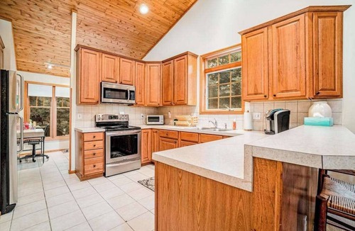 Glen Arbor House | Dog-friendly home with gorgeous garden & decks - stroll to town/the lake