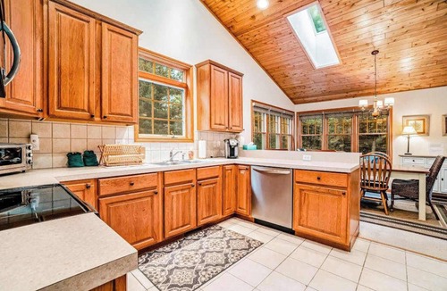 Glen Arbor House | Dog-friendly home with gorgeous garden & decks - stroll to town/the lake