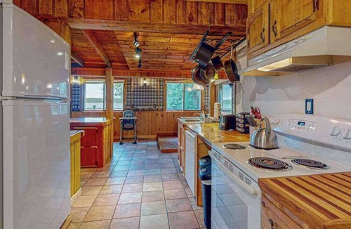Presque Isle House | Dog-friendly lakefront home with boat access, deck, fireplace, gas grill, kayaks