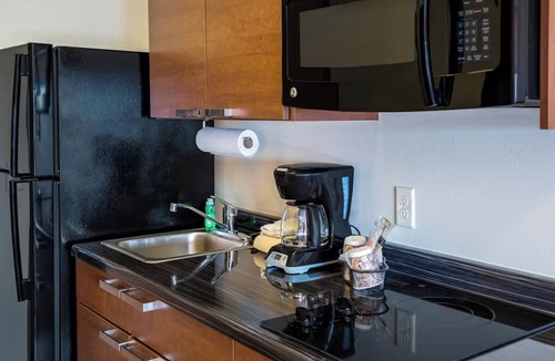 Grand Forks Hotel | Double Your Stay Fun – 2 Queen Bed + Recliner Suites Near Alerus, UND & Shops