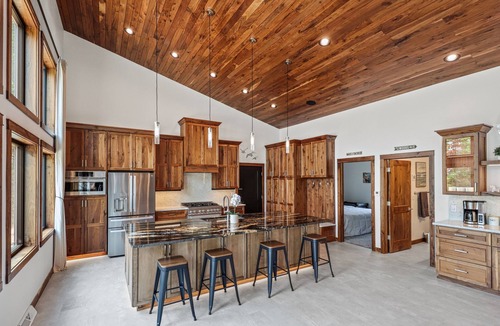 Oneida County Cabin | Escape to Lakeview Paradise, a luxury 4-bed, 3-bath lakefront retreat in Tripoli, WI. Each bedroom has a king bed, and the 2,560 sq. ft. home features high-end finishes, cozy comforts, and stunning lake views from a private 24-ft deck or hot tub.
