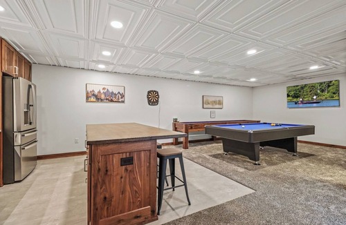 Oneida County Cabin | Escape to Lakeview Paradise, a luxury 4-bed, 3-bath lakefront retreat in Tripoli, WI. Each bedroom has a king bed, and the 2,560 sq. ft. home features high-end finishes, cozy comforts, and stunning lake views from a private 24-ft deck or hot tub.