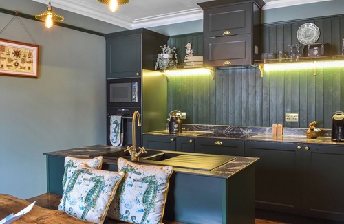 Sandhaven Cottage | Experience cosy comfort in this Cairnbulg holiday home, featuring a log fire.