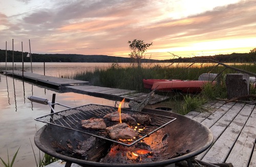 Lake Township Cabin | FLASH SALE Aug.18- 24! PRIVATE beach, boats, acreage, pets, Sleeping Bear Dunes