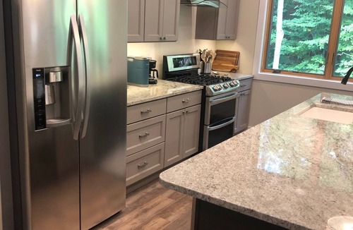Traverse City Condo | Forest & Brook View Condo – Tranquil Porch, Minutes to TC Breweries & Cafés!