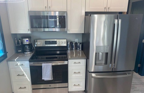 Charlevoix Condo | Full Kitchen & Laundry in Large Condo- Very Clean!