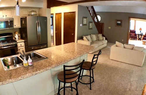 Higgins Lake House | Get away to this beautiful open concept house within walking distance to Higgins