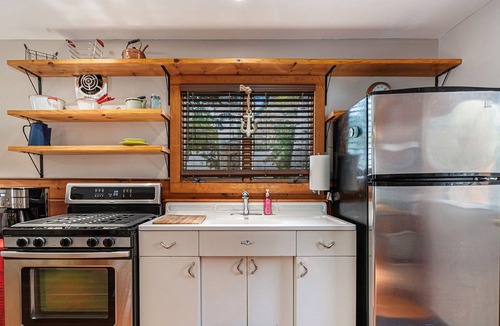 Indian River Cottage | Greet the morning sun with a view of the clear-flowing Indian River right outside the door