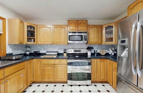Naples House | Hilltop Family Escape | River Rock Fireplace