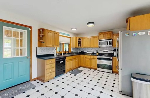 Naples House | Hilltop Family Escape | River Rock Fireplace