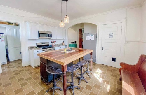 Manistee House | Historical dog-friendly home with fenced yard, grill, Ping-Pong, fireplace, & AC