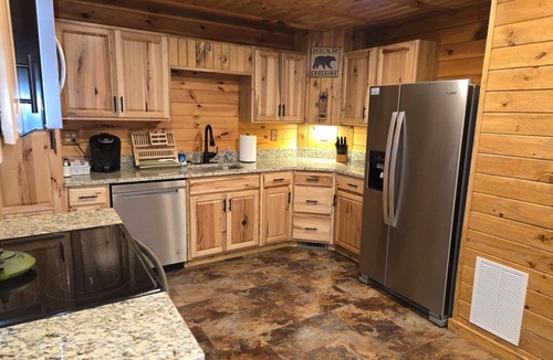 Logan Cabin | Hocking Hills Log Cabin in the Woods facing Rock formation