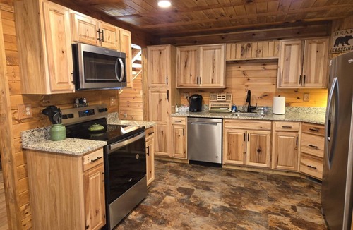 Logan Cabin | Hocking Hills Log Cabin in the Woods facing Rock formation