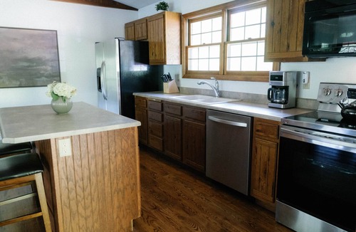Logan Ski Chalet | Houston Lodge, 5BR Lodge with a large covered porch and a great view