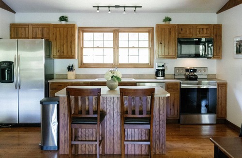 Logan Ski Chalet | Houston Lodge, 5BR Lodge with a large covered porch and a great view