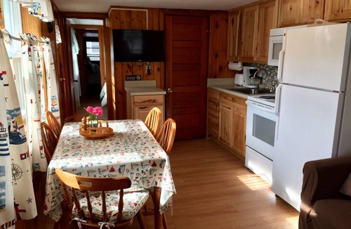 Hampton Cottage | Immaculate Cottage with flower-lined deck located in Island Area! Pet Friendly!