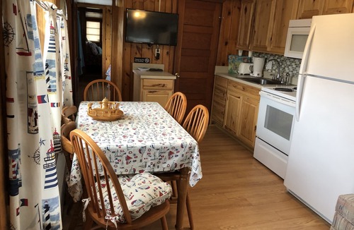Hampton Cottage | Immaculate Cottage with flower-lined deck located in Island Area! Pet Friendly!