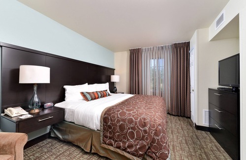 Okemos Condo | King Suite. Free Breakfast. Pool. Near Michigan State University.