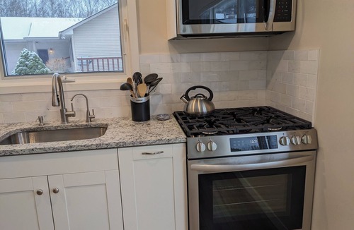 Lake Ann Cottage | Lake Ann, MI cozy waterfront cottage, quiet surroundings, private beach & dock