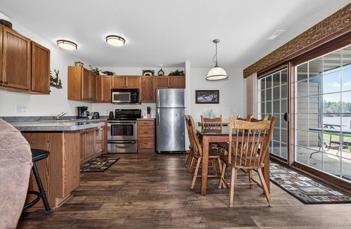 Eagle River Condo | Lake front 2-bedroom on Eagle River Chain of Lakes with indoor pool and jacuzzi!