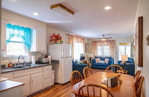 Logan Cottage | Lake Front Oasis: 3 BR 2 Bath w/dock, fire pit, sun room, hot tub on Lake Logan