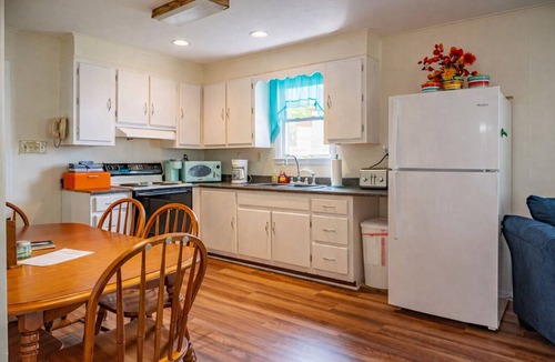 Logan Cottage | Lake Front Oasis: 3 BR 2 Bath w/dock, fire pit, sun room, hot tub on Lake Logan