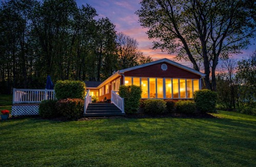 Logan Cottage | Lake Front Oasis: 3 BR 2 Bath w/dock, fire pit, sun room, hot tub on Lake Logan