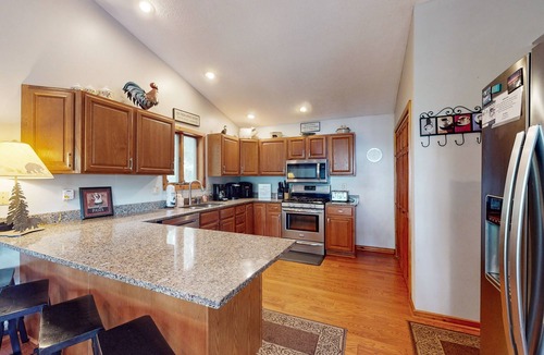 McHenry Ski Chalet | Lake-view home with hot tub, dock, decks, firepit, & AC - near slopes, dogs OK