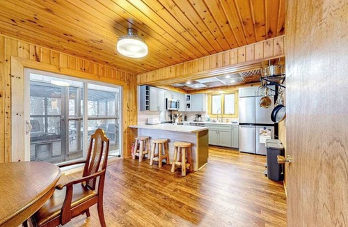 Lac du Flambeau House | Lakefront dog-friendly retreat with sauna, dock, canoe, paddle board, & firepit