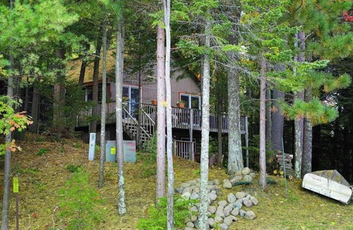 Lac du Flambeau House | Lakefront dog-friendly retreat with sauna, dock, canoe, paddle board, & firepit