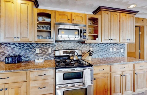 Norway House | Lakefront, dog-friendly home with dock, kayaks, SUPs, canoe, huge deck & firepit