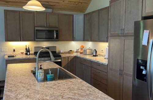 Danbury House | Lakefront home on all-sports lake, private shore 35-acre retreat.