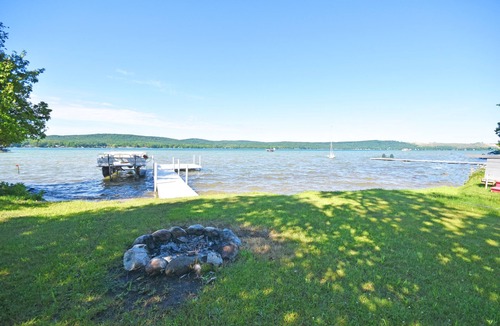 Empire Cottage | Lakefront home on Little Glen Lake with fireplace, deck, gas grill, and firepit