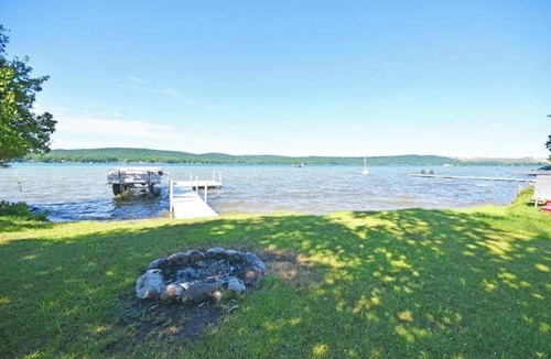 Empire House | Lakefront home on Little Glen Lake with fireplace, deck, gas grill, and firepit