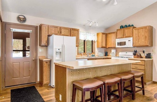 Lac du Flambeau House | Lakefront home with firepit, screened porch, WiFi, central AC, and kayaks