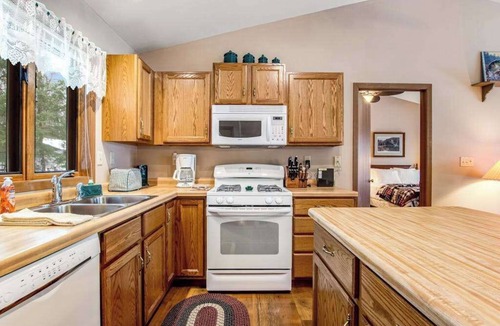 Lac du Flambeau House | Lakefront home with firepit, screened porch, WiFi, central AC, and kayaks