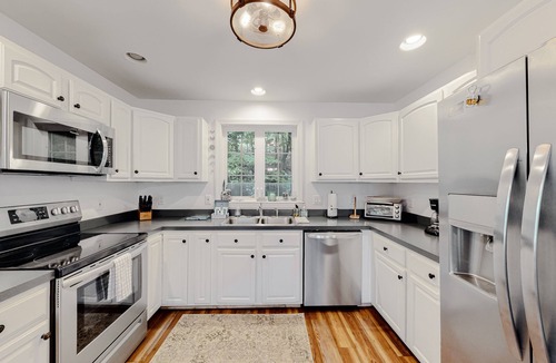 Windham House | Lakefront home with sunrise views, private dock, kayaks, paddle boards, WFH desk