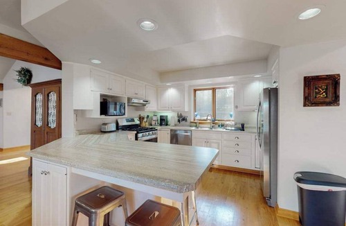 Hazelhurst House | Lakefront home with private outdoor sauna, dock, firepit, wood fireplace & patio