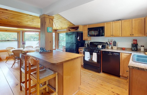 Litchfield Cabin | Lakefront home with firepit, yard, dock/water access, outdoor area, & W/D